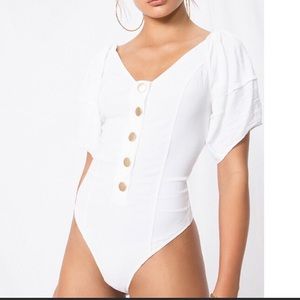 Free People not basic bodysuit in white w/ gold buttons. Size XS/TP.